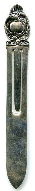 This bookmark was made in a South American country. It is marked with an anchor hallmark and 900. The top is in the shape of a flower.
