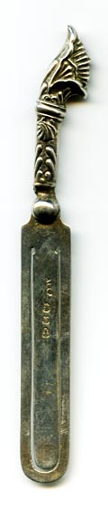 This bookmark  was made in Birmingham England. It has the hallmarks for sterling and the year 1896. It is in the shape of a knife with a handle that looks like a flower.