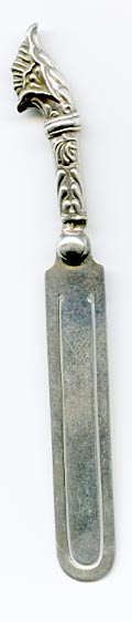This bookmark  was made in Birmingham England. It has the hallmarks for sterling and the year 1896. It is in the shape of a knife with a handle that looks like a flower.
