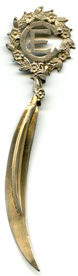 This bookmark was made in the US by W.C. Finck. It is marked sterling and a rubbed out manufacturers mark. The letter E surrounded by a wreath of very detailed flowers is the symbol of the United Society of Christian Endeavor. It is finished in a gold wash. 