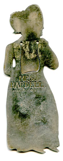 his bookmark was made in the US by J.F. Fradley. It is marked on the back with sterling, the manufacturers hallmark of a cross, the numbers 1863 and 4, and Mrs. Bardell. This is a figure of the Dickens character Mrs. Bardell from the book 'The Pickwick Papers.'" The date is 1890 - 1936. "
