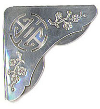 This bookmark was made in the US by Gorham. It is marked Gorham Sterling for Gump's. It is a corner page marker with a kind of Asian motif. Date is unknown.