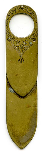 This bookmark was made in England at or before the turn of the last century. The top has a glass magnifying glass which is surrounded by an ornate scribed design. This is almost identical to bookmark  1076  except this is brass and the other silver.