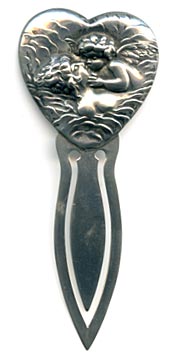 This bookmark was made in the US by Unger Bros. The top is a heart shape with an angel/cherub kissing someone in the water. 