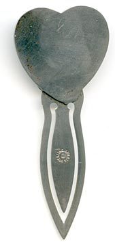 This bookmark was made in the US by Unger Bros. The top is a heart shape with an angel/cherub kissing someone in the water. 
