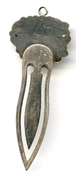 This bookmark was made in the US by an unknown maker  but it closely resembles those of Unger Bros. The top is a flower and has a loop for a tassel. 