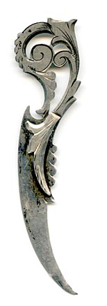 This bookmark was made in the US by an unknown manufacturer. It is marked sterling on the back. The top is a flowery Art Nouveau design with the top smaller blade in the shape of a leaf.