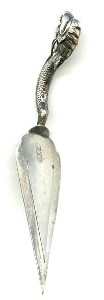 This bookmark was made in China and is hallmarked with Chinese symbols. It is in the shape of a trowel with a dragon as the handle.