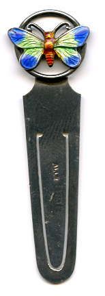 This bookmark was made in Birmingham England by Adie and Lovekin. It has the date mark of g for 1906. The top is a beautiful enamel butterfly.