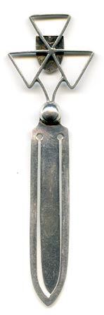This bookmark, a 'Jersey' souvenir, was made in Birmingham England in 1925 by E Horton & Co. It is a George V English sterling silver bookmark with an enamel coat of arms on a three point cross above a ball.