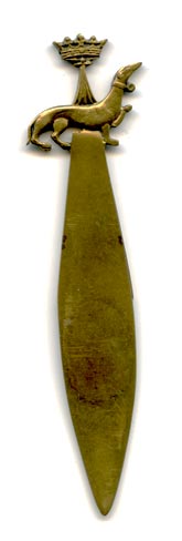 This bookmark was made in France. It is brass, has Chaumont inscribed on the top blade and has a dog and crown on the top.