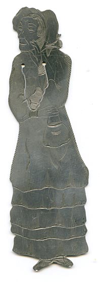 This bookmark was made in the US by J.F. Fradley. It is marked on the back with sterling, the manufacturers hallmark of a cross, the numbers 1863 and 36, and Mrs. Jellyby. This is a figure of the Dickens character from the book "Bleak House." The date is 1890 - 1936.