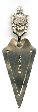 This bookmark was made in England and has the sterling hallmarks for Birmingham 1903. It is in the shape of a trowel with a crested handle from Glastonbury Abbey.