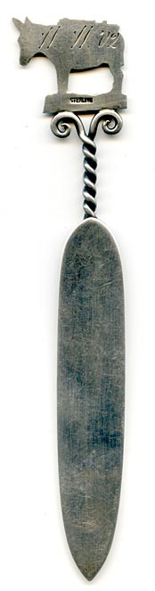 This bookmark was made in the US by an unknown manufacturer. The top is a donkey packed up and ready to go prospecting. The blade is engraved Denver. The back is marked sterling and engraved W.W. '02.