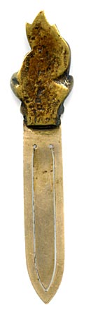 This bookmark was made in Europe by an unknown manufacturer. The top is a high relief solid brass Imp, possibly the Lincolnshire Imp, and the blades are a white metal. The Imp is sitting cross legged with a big grin.