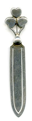 This bookmarks was made in England by William J. Holmes in 1903. The top is a three leaf clover in connemara marble.