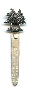 This bookmark was made in the US by an unknown manufacturer. The top has two Christmas trees. The blade says Bickelmann Schenectady.