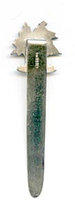 This bookmark was made in the US by an unknown manufacturer. The top has two Christmas trees. The blade says Bickelmann Schenectady.
