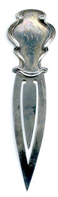 This bookmark was made in the US by Unger Bros. It is marked with the manufacturers mark of an intertwined U and B surrounded by Sterling 925 Fine. It can be dated to 1904 as seen in the catalog. 