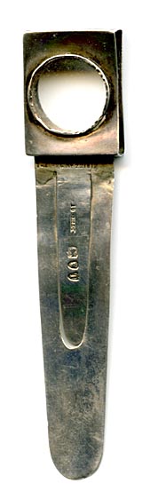 This bookmark is made in London, England. The manufacturer's mark is S.M. & Co. for Sampson Mordan & Co. The top is a magnifying glass and has a place for a tiny book (which unfortunately is missing). The date is 1894.
