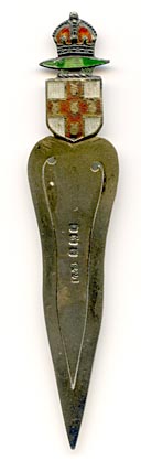 This bookmark was made in Birmingham England. It is hallmarked for that city and the year 1905 and has the manufacturers hallmark L&S for Levi & Salaman. The top has an enamel coat of arms with a red crown on top.