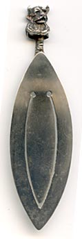 This bookmark was made in Birmingham England by an unknown manufacturer with the hallmark of T&JB. It has the date mark of g indicating 1906. The top is a figural Lincolnshire Imp, seen in the Angel Choir at Lincoln Cathedral.
