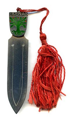 This bookmark was made in Finland. It is marked for the year 1957 and 813H indicating a silver content of .830. The top is an enamel coat of arms for the town and former municipality of Ekenäs which has merged with Pohja and Karis to form the new municipality of Raseborg on January 1, 2009.
