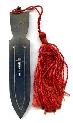 This bookmark was made in Finland. It is marked for the year 1957 and 813H indicating a silver content of .830. The top is an enamel coat of arms for the town and former municipality of Ekenäs which has merged with Pohja and Karis to form the new municipality of Raseborg on January 1, 2009.