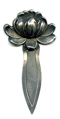 This bookmark was made in the US by an unknown manufacturer. It is marked sterling on the back. The top is a flower in full bloom.