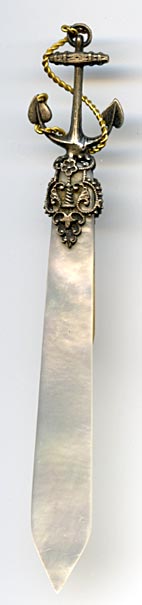 This bookmark was probably produced in France. It is made of mother-of-pearl and brass plate over pot metal. It has a very detailed anchor wrapped in a gold rope. The blades are light and dark MOP. The date is 1880 - 1900.