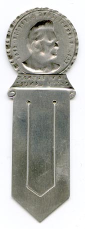 This bookmark was made in Norway. It is marked with a hallmark and  830S.  The top is a bust of of Bjørnstjerne Bjørnson. Bjørnson (1832-1910) was a famous Norwegian writer who won the Nobel Prize in Literature in 1903. The bookmark is from 1932 and was made in connection with celebration of Bjørnson`s 100 year anniversary of his birth.  On the front is the first part of Norway`s national anthem; “JA VI ELSKER DETTE LANDET”