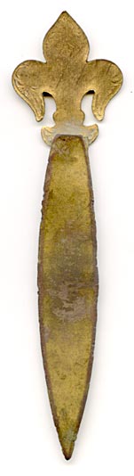 This bookmark is made of pot metal with a gilt finish and has  enamel on the top part in the shape of a fleur-de-lis. Date is unknown. It's probably French made.