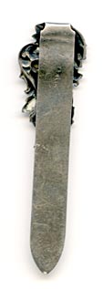 This bookmark was made in the US by an unknown manufacturer. It is very small and has an art nouveau design as the top blade.