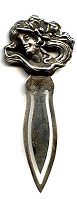 This bookmark was made in the US by an unknown manufacturer. It is marked sterling on the back. The top is an art nouveau woman's head with long flowing hair.