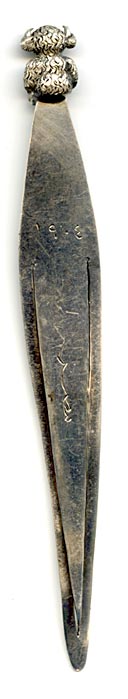 This bookmark was made in Birmingham England by an unknown manufacturer with the hallmark of B.H.J. It has the date mark of e indicating 1904. The top is a figural Lincolnshire Imp, seen in the Angel Choir at Lincoln Cathedral.