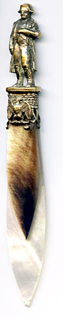 This bookmark was made in France as a souvenir of the Musee de L'Armee. It is silver plated brass, abalone and mother-of-pearl. The top has a statue of Napoleon. Underneath there is an eagle. The Musee de L'Armee, located at the Invalides in Paris, France was originally built as a hotel for disabled soldiers (Invalides) by Louis XIV and now houses the Tomb of Napoleon 1st and the museum of the Army of France.
