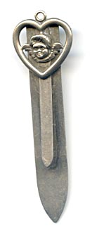This bookmark was made in the US. It is marked sterling and has an unknown makers mark of either a reversed B and R or a three leaf clover. The top is a heart with an angel head in the center. 