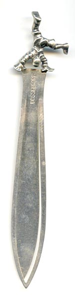 This bookmark was made in Germany. It is marked Dusseldorf and 800 on the back. The top is a clown doing a hand stand. The blade is inscribed "Denk an mich  Elke" which translates to “Think of me Elke”.