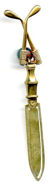 This bookmark was made in France. It has two crossed golf clubs with an agate marble between them on the top.