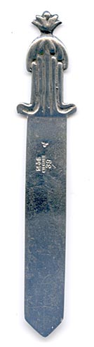 This is an American made bookmark. The manufacturer is Gorham. It is marked with the manufacturers hallmark, Sterling and the catalog number 39.  The top has an acorn design. It's nicely detailed. It is from the Autumn 1888 Gorham Catalog (although the date mark on this particular bookmark is from 1890). It is one of 33 different bookmarks offered that year.