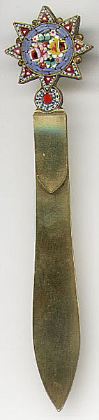 This bookmark is a mosaic piece made of brass. It is manufactured in Italy between 1910 - 1940.