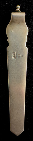 This bookmark was made in the US by Gorham Mfg. Company. It is marked with the manufacturers mark, sterling 30 and a star (indicating 1871). 30 is the number from the Autumn 1888 catalogue.