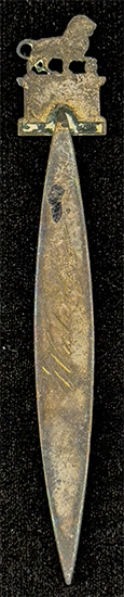 This bookmark was made in France by an unknown manufacturer. It is unmarked and is made of brass. The top is a figural lion and the top blade has a bust of Napoleon. Under the lion it is inscribed XVIII JUNI MDCCCCXV, the date the Battle of Waterloo started