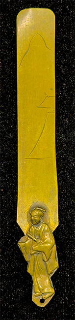 This bookmark was made in Japan by an unknown manufacturer. It is unmarked and is made of brass. The top is a figural Japanese man.