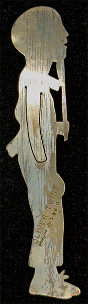 This bookmark was made in the US by J.F. Fradley. It is marked on the back with sterling, the manufacturers hallmark of a cross, the number 7, and Oliver Twist. This is a figure of the Dickens character from the book with the same name. The date is 1890 - 1936.