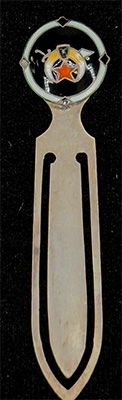 This bookmark was made in the US by F.A. Hermann Co. It is hallmarked sterling on the back. The top is an enamel shield with a red star and horns?. This is possibly a university emblem. The date is 1900 - 1910.