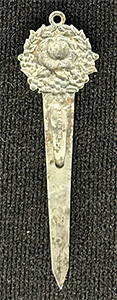 This bookmark was made in the US by an unknown manufacturer. It is marked sterling on the back. The top is a a rose surrounded by a wreath.