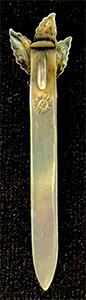 This bookmark was made in the US by Unger Bros. It is marked with the makers hallmark and Sterling 925 Fine. It a leaf design on top. This bookmark was sold from the 1904 Unger Bros. catalog.