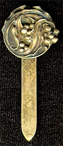This bookmark was made in the US by Unger Bros. It is marked with the makers hallmark and Sterling 925 Fine. It an art nouveau flower design. This bookmark was sold from the 1904 Unger Bros. catalog.