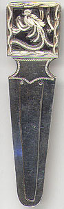 This bookmark was manufactured in Guatemala. It is marked GUAT 900 indicating 900 silver. It is a picture of quetzal bird with a long feather tail.  It is the national bird of Guatemala.